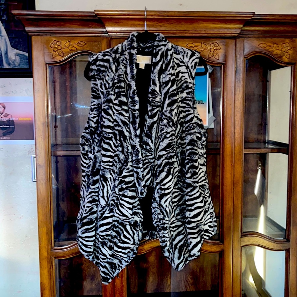 Black and white zebra pattern Michael Kors vest also super fuzzy and soft